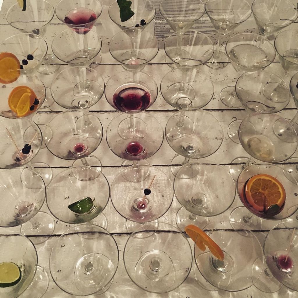 A table full of empty martini glasses