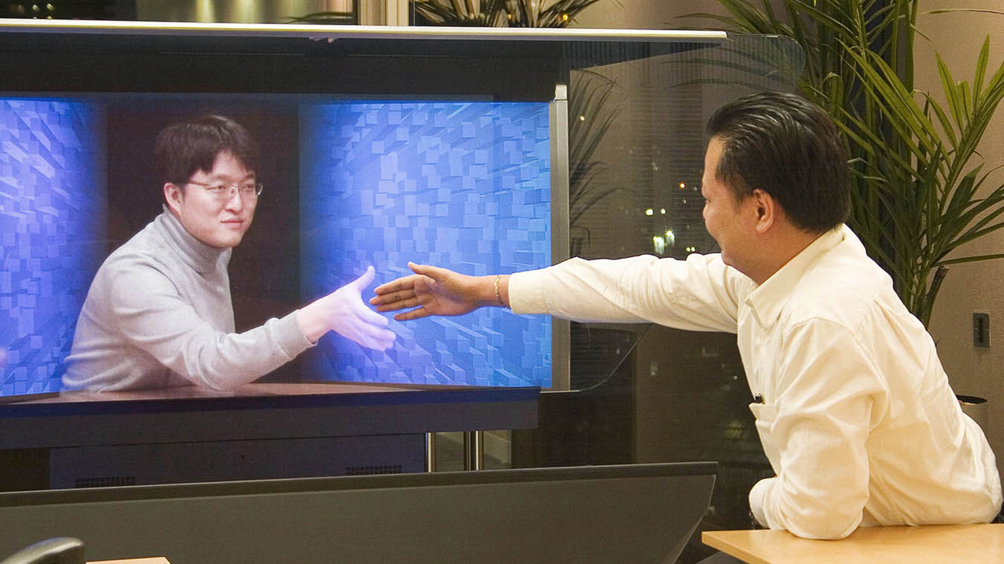 “Holographical Reality™ provides the ultimate communications experience by generating the three dimensional embodiment of the transmitted person to appear in the room for natural human communication.” Credit: TelepresenceTech