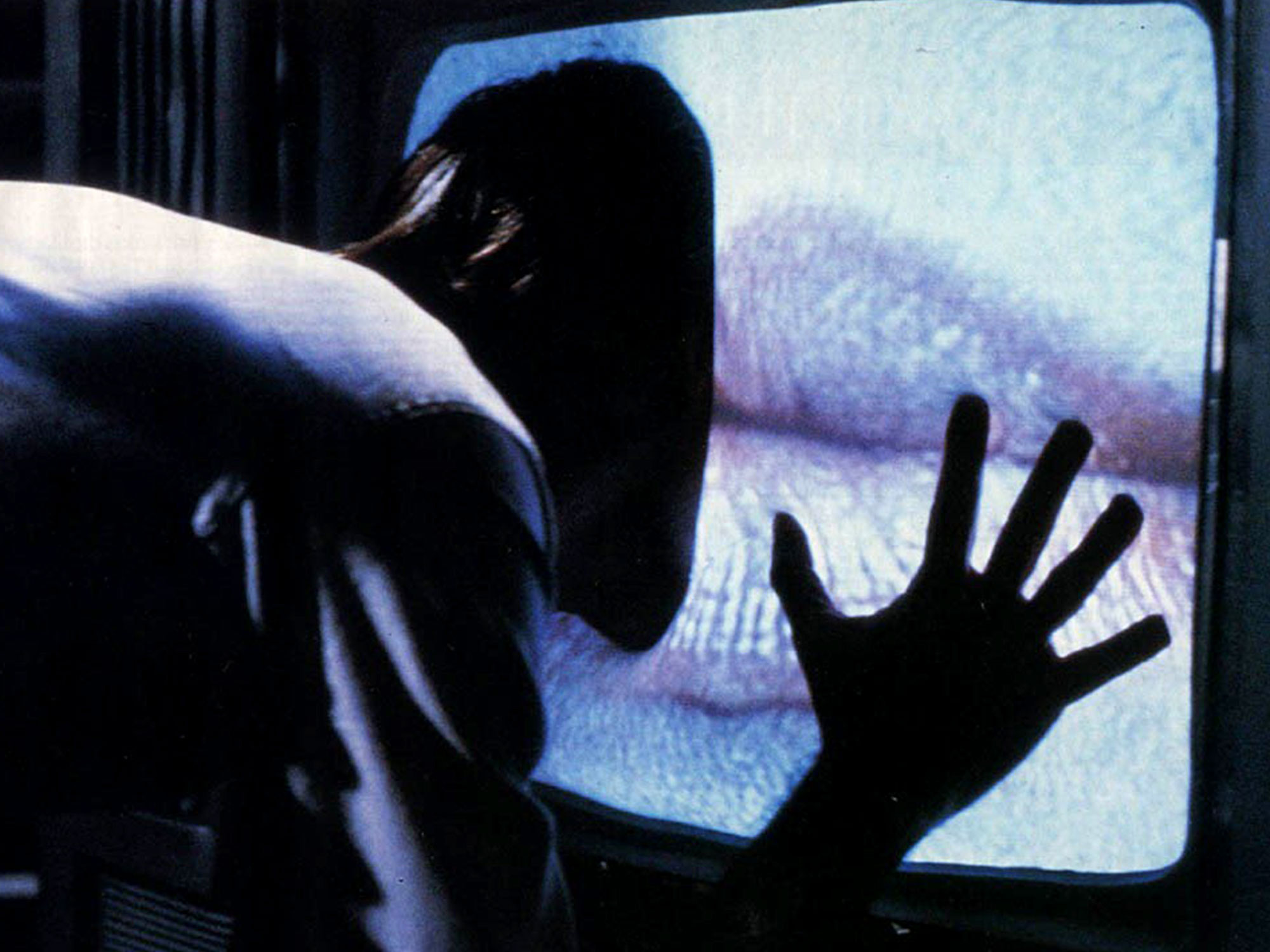 Still from Videodrome (1983) of a fleshy, pleasure-giving and -receiving television.