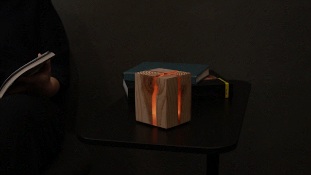 A video GIF showing "Handheld Fireplace" by I-Jon Hsieh.