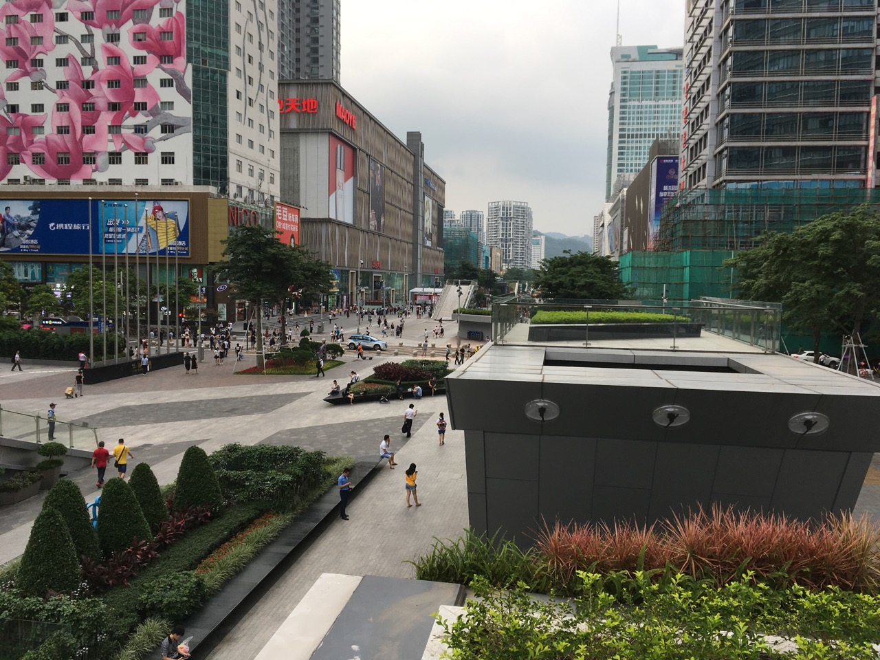A recent green pedestrian walkway between buildings in Shenzhen, China. Each building contains hundreds or thousands of small electronics businesses. 