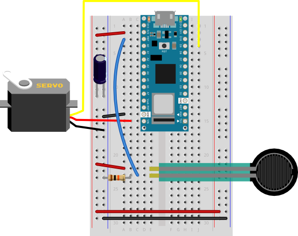 Breadboard view of a servomotor and an analog input attached to an Arduino Nano. 