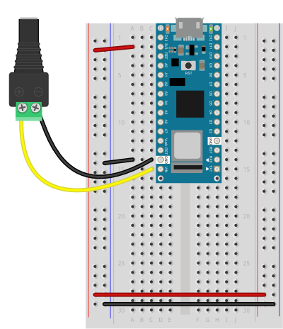 Breadboard view of a Nano 33 IoT on a breadboard connected to a DC power jack for external DC powering.