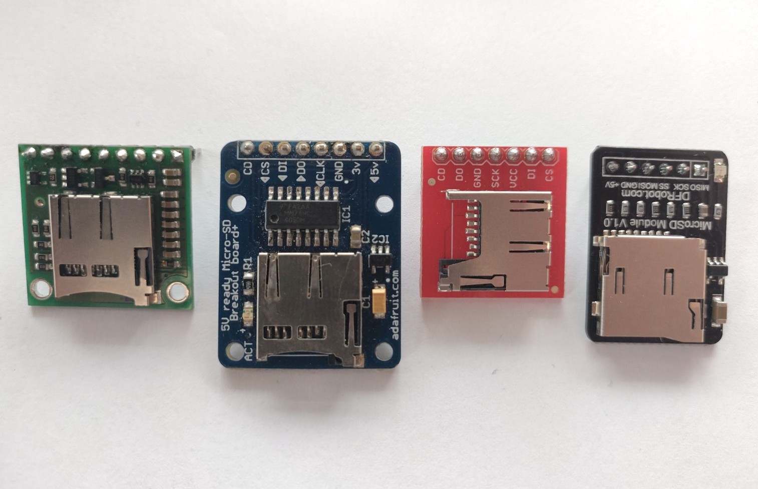 Photo of four different microSD breakout boards. 