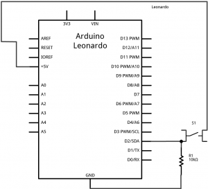 Schematic drawing of an Arduino Leonardo connected to a pushbutton and two voltage divider inputs. The pushbutton is connected as described in the schematic above. On the left side of the board, two photoresistors are connected to +5 volts. The other sides of the photoresistors are connected to analog inputs A0 and A1, respectively. Two 10-kilohm resistors are also connected to those pins. The other sides of the fixed resistors are connected to ground.