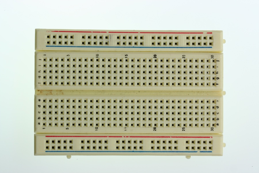 A small solderless breadboard with no components on it.