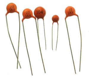 Ceramic capacitor. This component has a disc top and two wire legs. You measure the capacitance between the two legs. Ceramic disc capacitors like this are generally low-capacitance components.