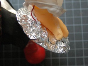 Detail of the cymbal monkey's cymbal. It is covered with tin foil, as described above. 