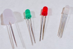 LEDs. Shown here are four LEDs. The one on the right is an RGB LED. You can tell this because it has four legs, while the others have only two legs.