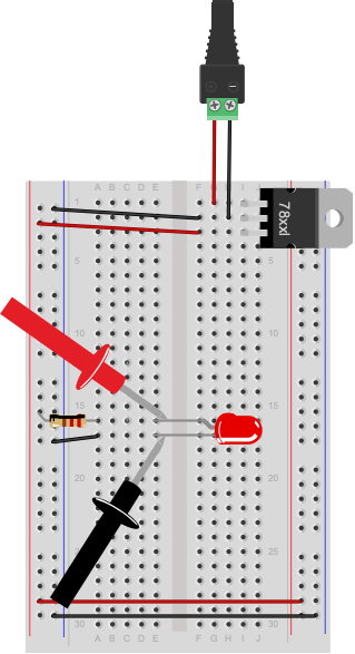 Breadboard drawing of measuring voltage across an LED. The LED circuit is the same as shown above. The red probe of a multimeter is touching the anode of the LED. The black probe of the meter is touching the cathode of the LED.