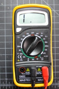 Photo of a multimeter set to measure resistance. The dial is pointing to a setting marked 20k in a section of the dial marked with the Greek letter omega.