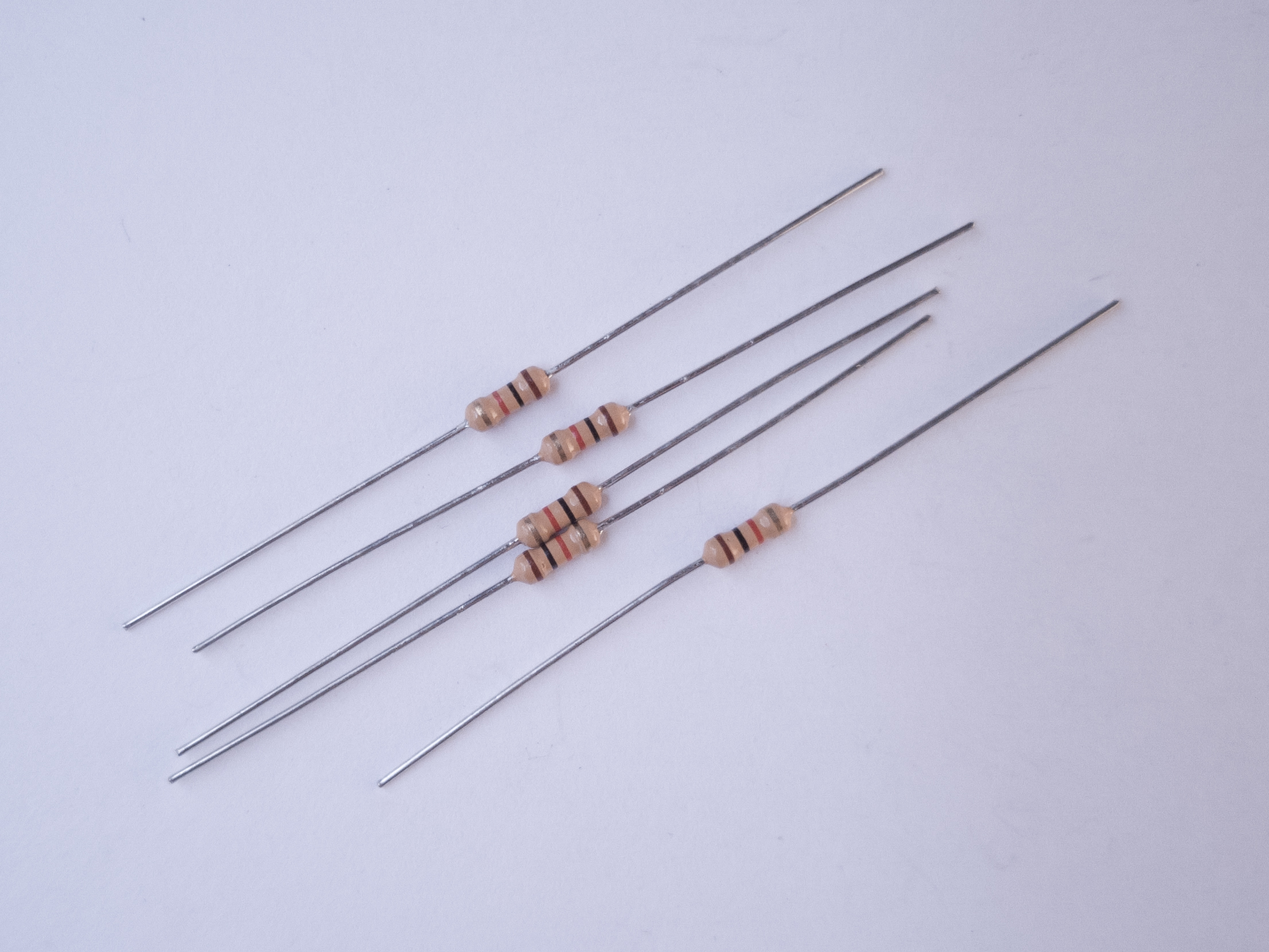 Photo of a handful of 1-kilohm resistors.