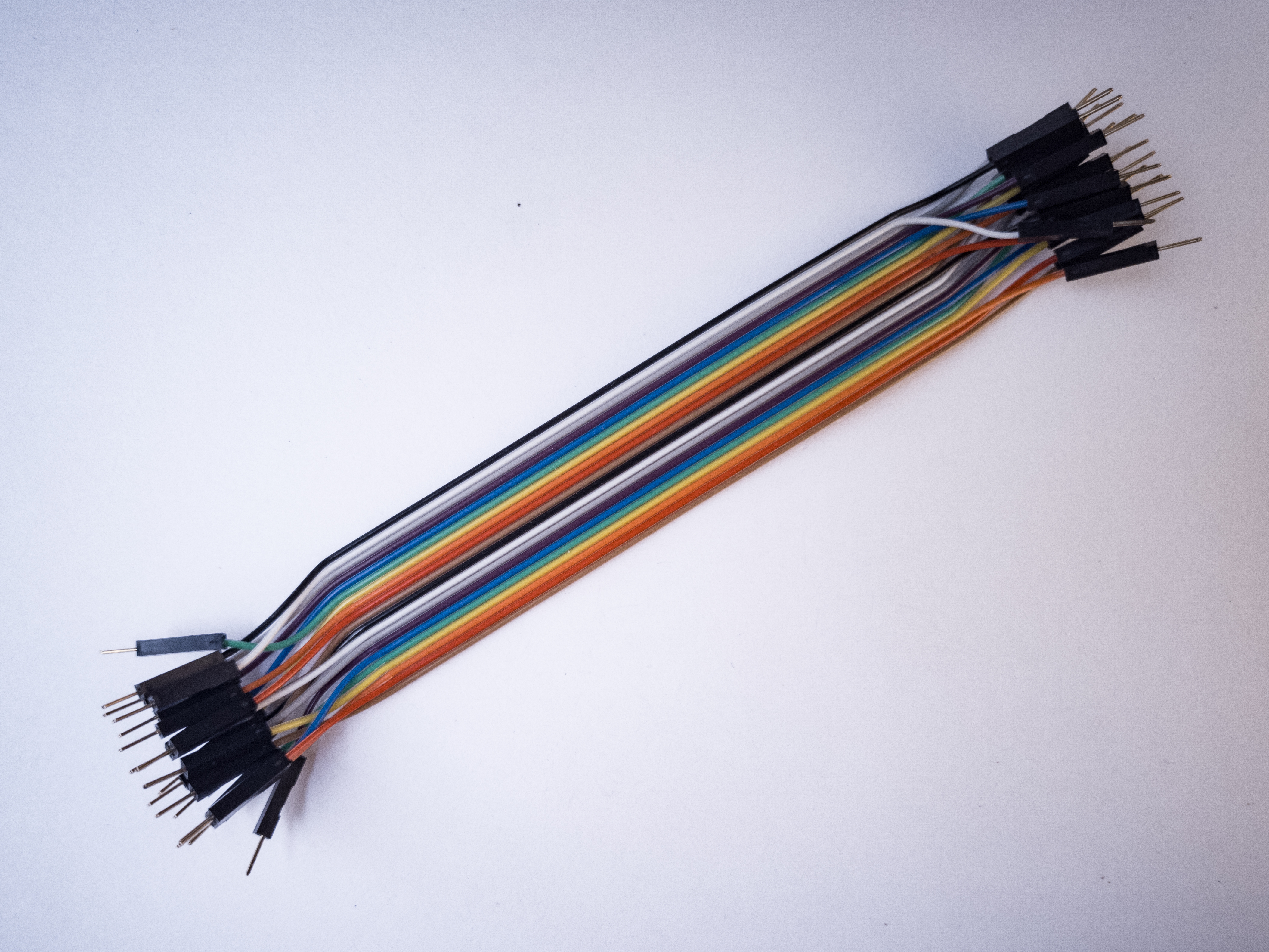Photo of flexible jumper wires. These wires are quick for breadboard prototyping, but can get messy when you have lots of them on a board.