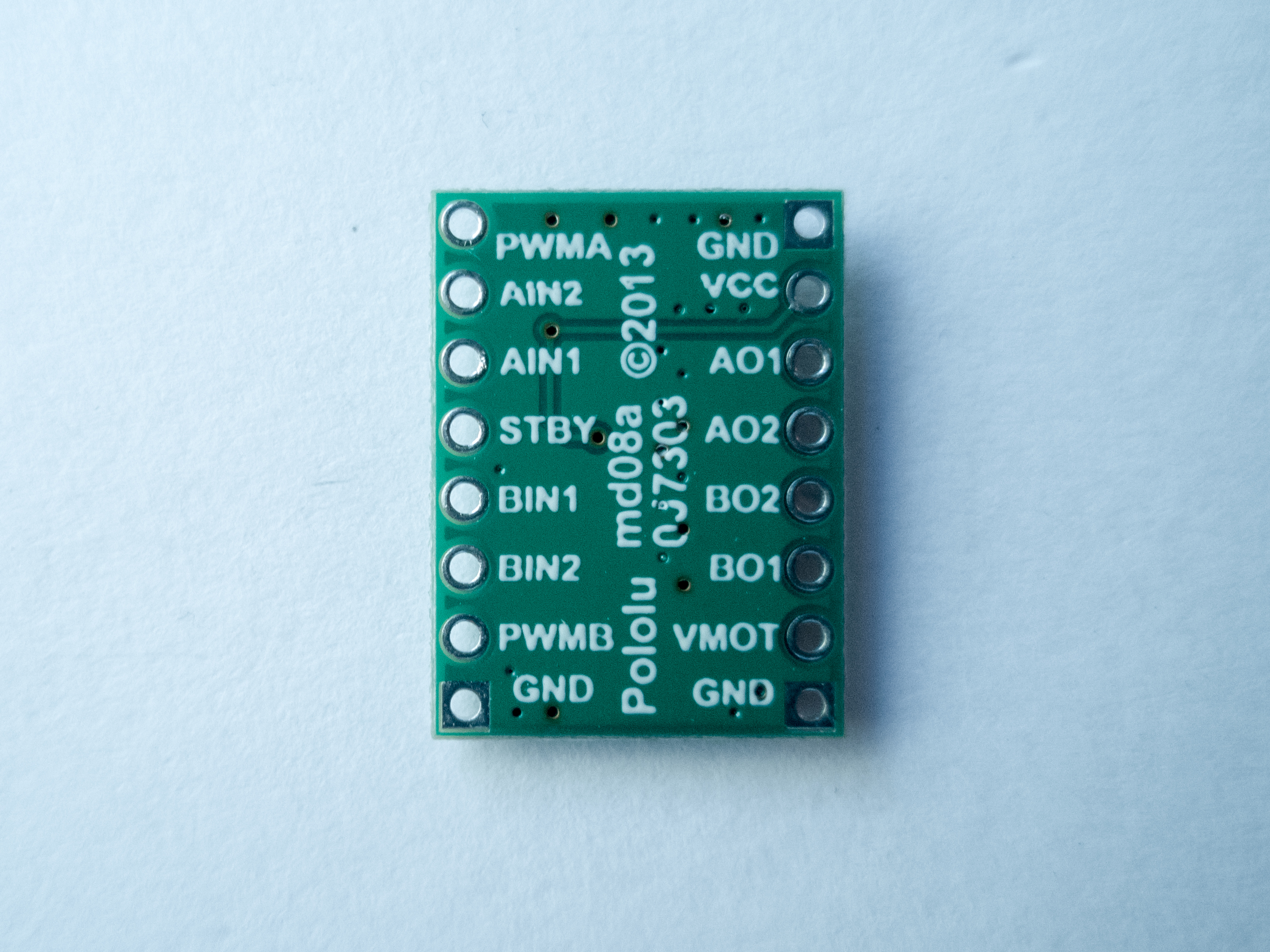 Photo of a motor driver, Pololu's TB6612FNG Dual Motor Driver Carrier (back of the board)