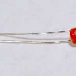 Photocell, or light-dependent resistor. This component has a round top and two wire legs. You measure the resistance between the two legs and expose the top to a varying light source in order to vary the resistance between the two legs.