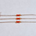 Resistors. Shown here are 220-ohm resistors. You can tell this because they have two red and one brown band, followed by a gold band.