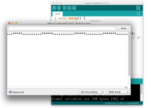The Arduino IDE with the serial monitor open. There is a string of random characters in the serial monitor
