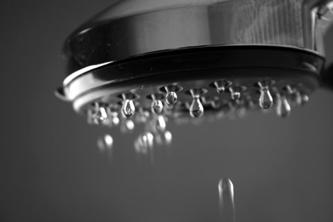 Water droplets coming out of faucet