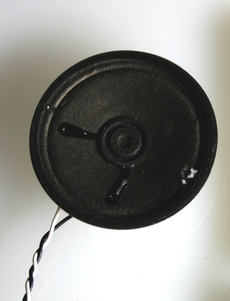 An 8 ohm speaker with 2 wires solder to the speakers leads