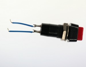 A pushbutton with two wires soldered one to each of the button's contacts.