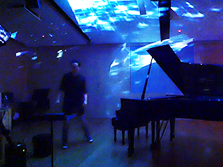 I created a system to seamlessly integrate music, visuals, and depth sensory data to perform as a conductor. The performer moves in a space to conduct music samples and generative visuals.