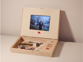 A photobox with a few control buttons displaying a photo on the screen
