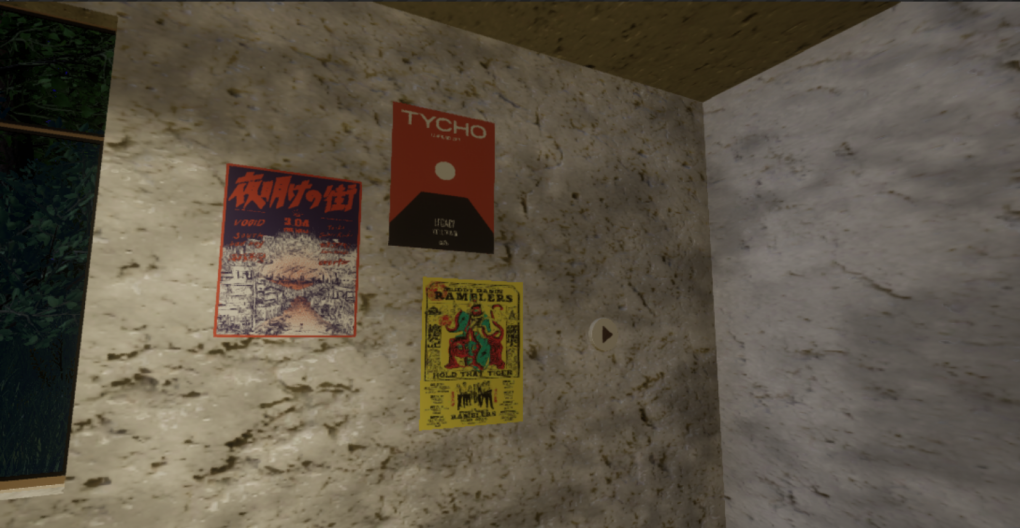 three posters on the wall, and there is a button on the wall too.