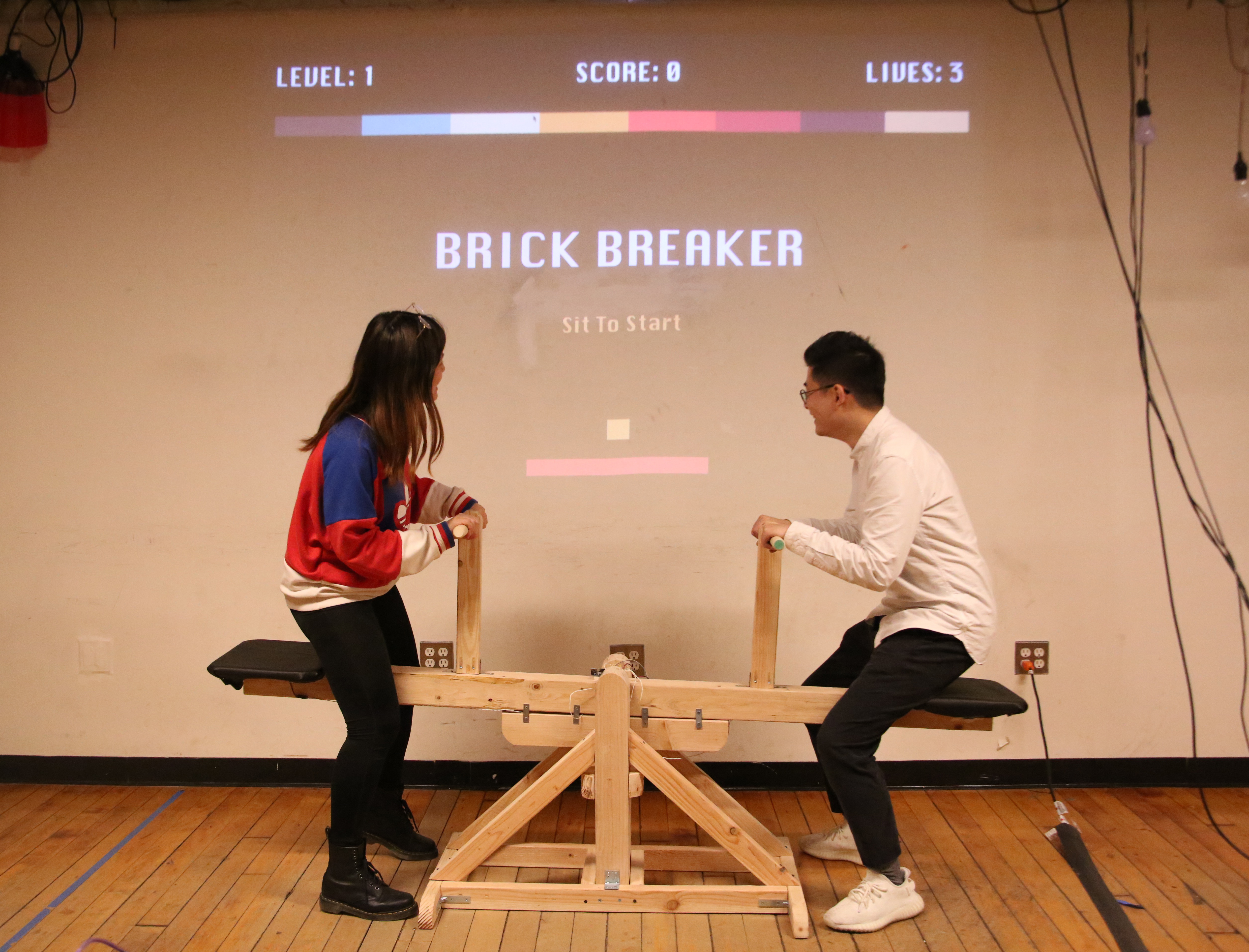 A playful work exploring new experience of familiar childhood games: seesaw and brick breaker.