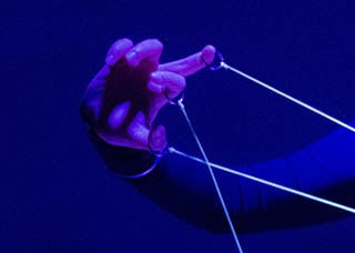 Emotions on line is a wearable instrument that generates sound by pulling strings out of a retractable custom mechanism attached to the performer's body. To find out more please stay on line.