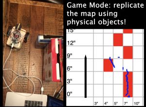 A split-screen view of 2 images with the title "Game Mode: replicate the map using physical objects!": On the left, there's a birds-eye view of a car on a tabletop with 2 boxes. On the right, there's a digital map where the edges of th
