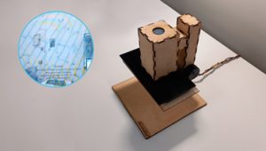 The image shows a designed microscope and a photo showing how the room will look through the lens