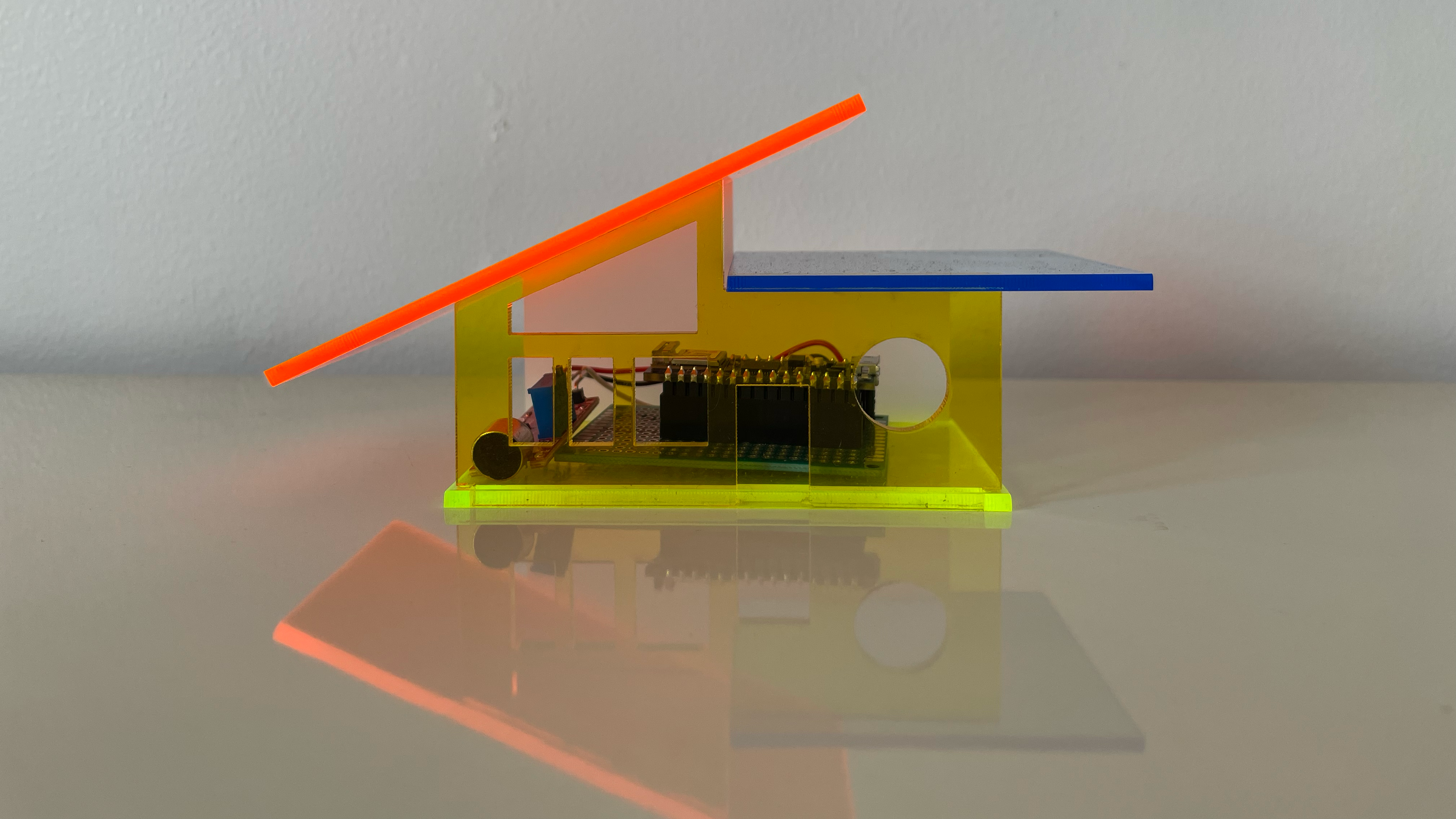 small acrylic house with sound sensor