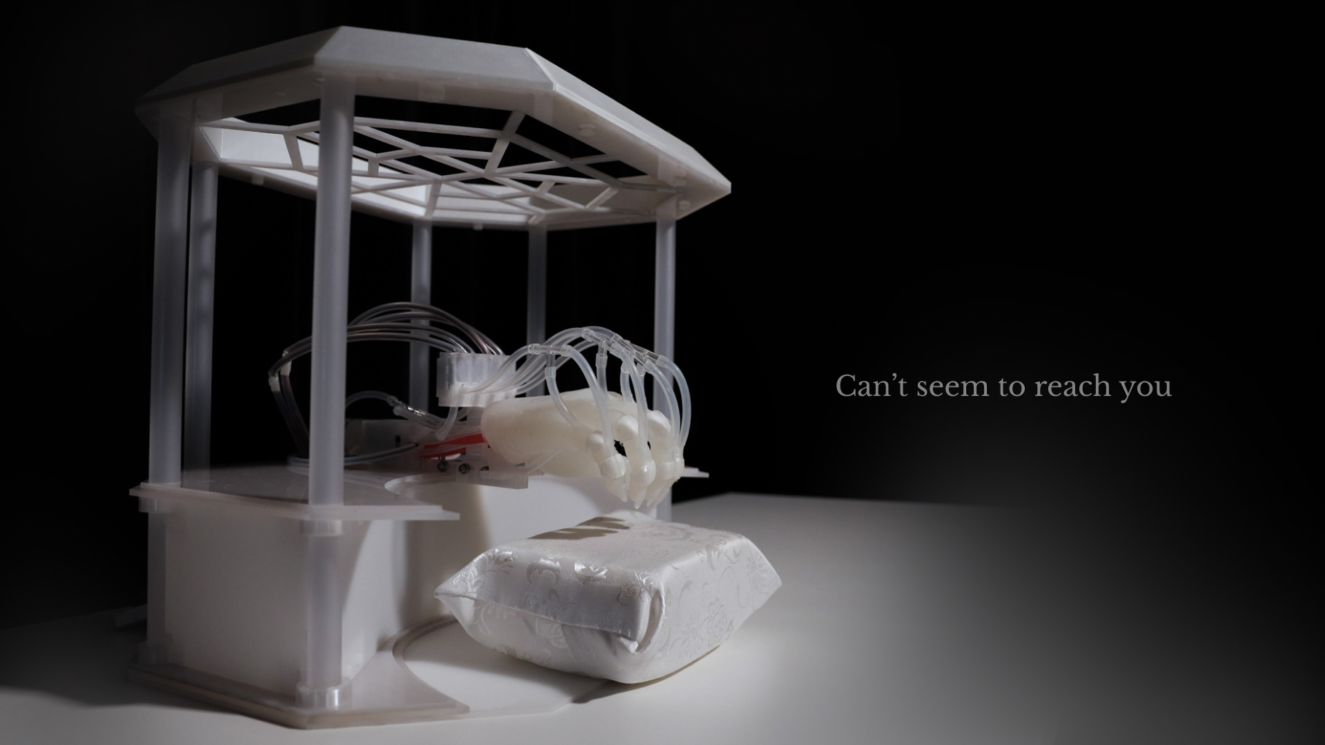 a soft robotic hand in an altar-like structure