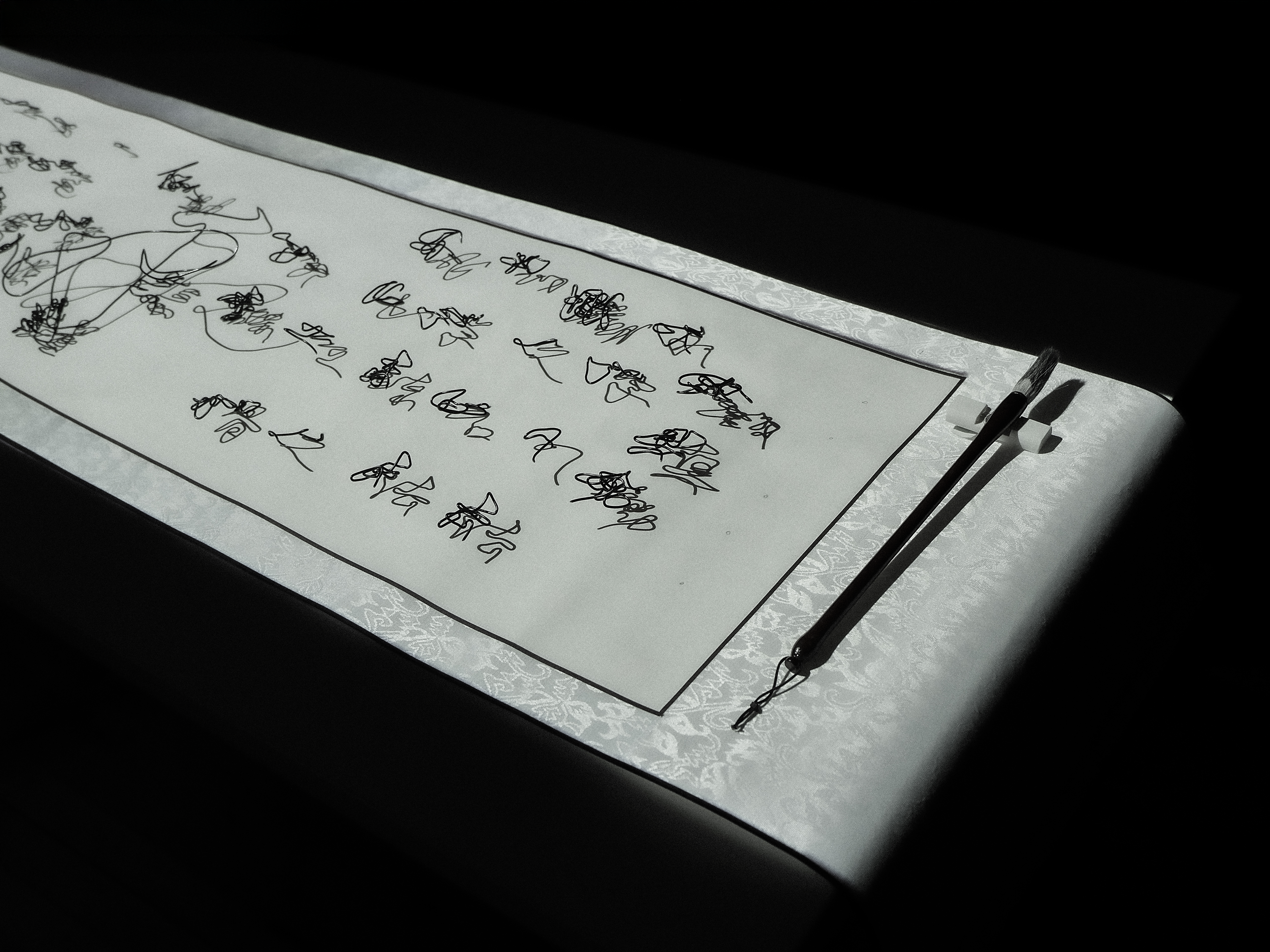 Image of an installation with wire structures and projections.