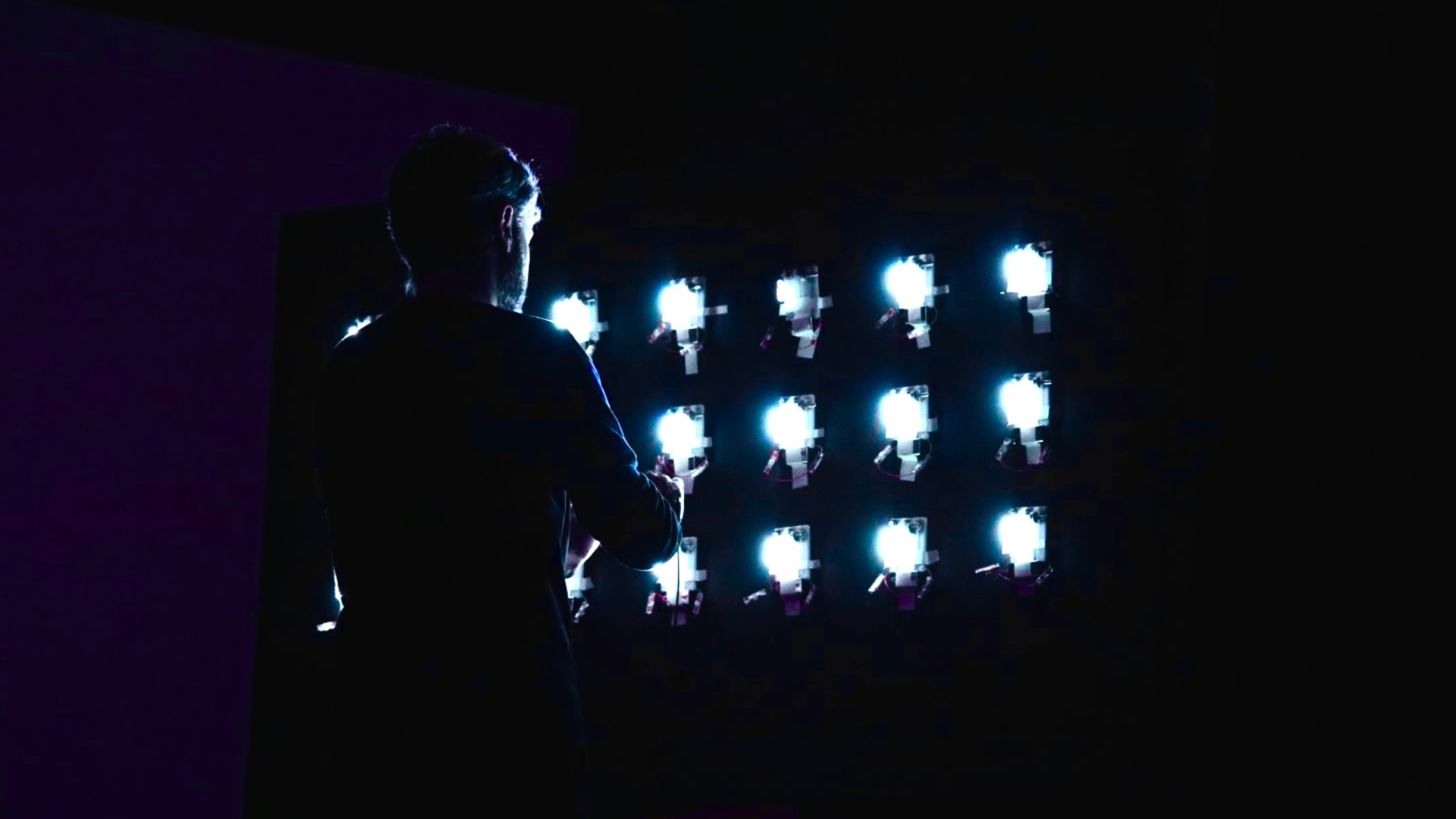 A wall with two magnetic light-emitting devices attached to it.