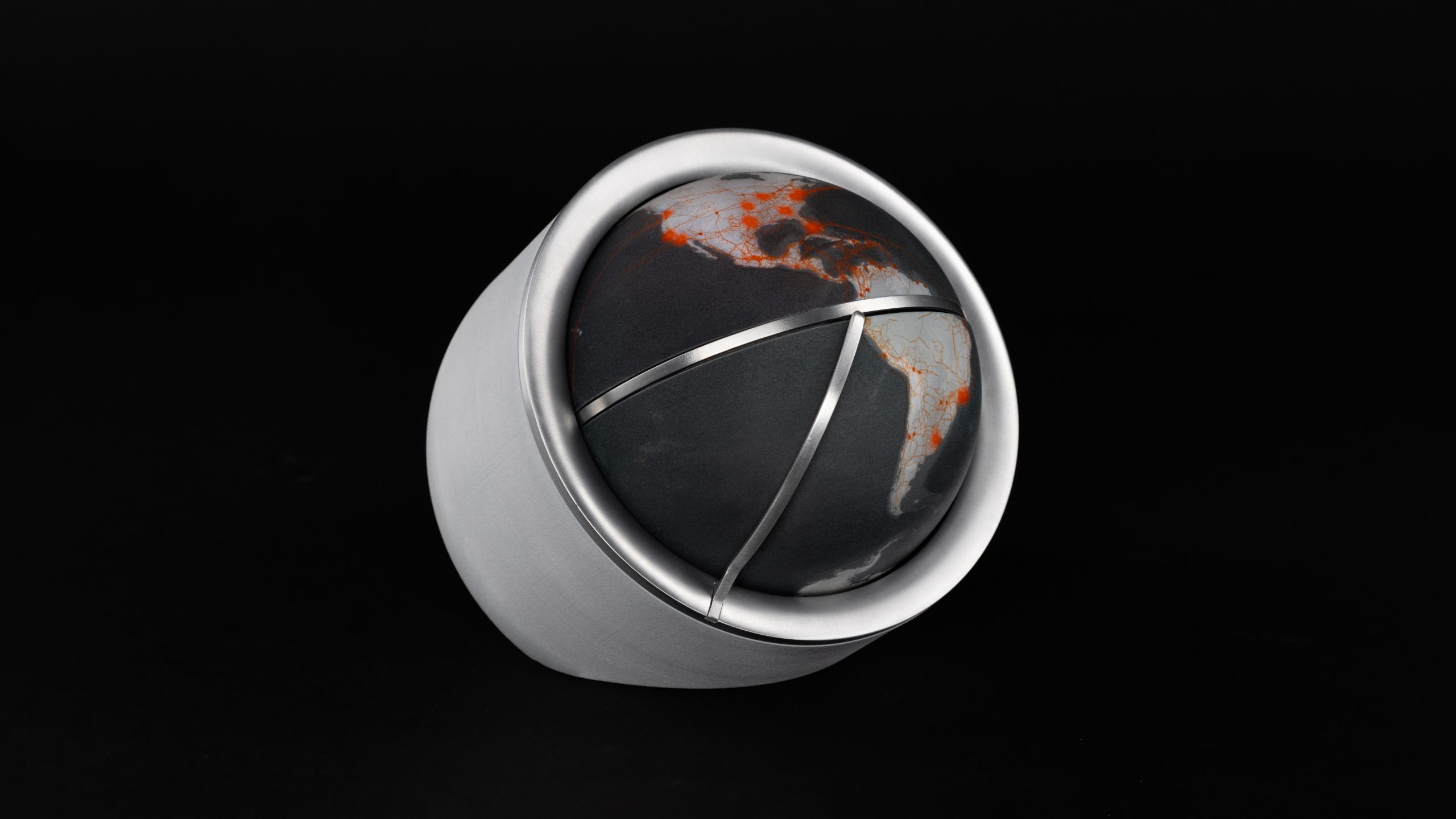 Object with an inset globe sitting on a tabletop