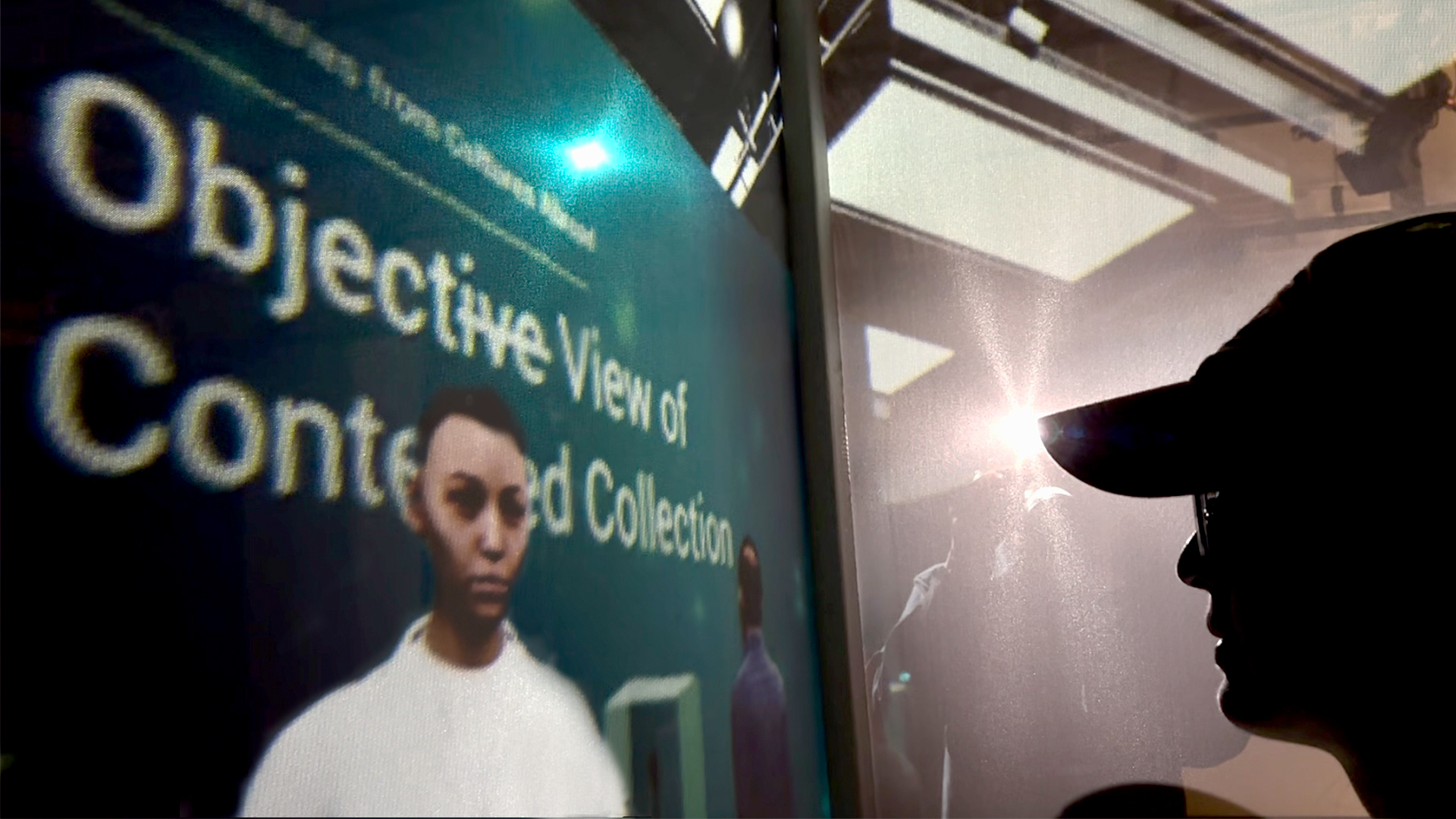 A image of a visitor at the installation taken inside the display box section with a museum scene projected on the box and a person outside the box taking a picture