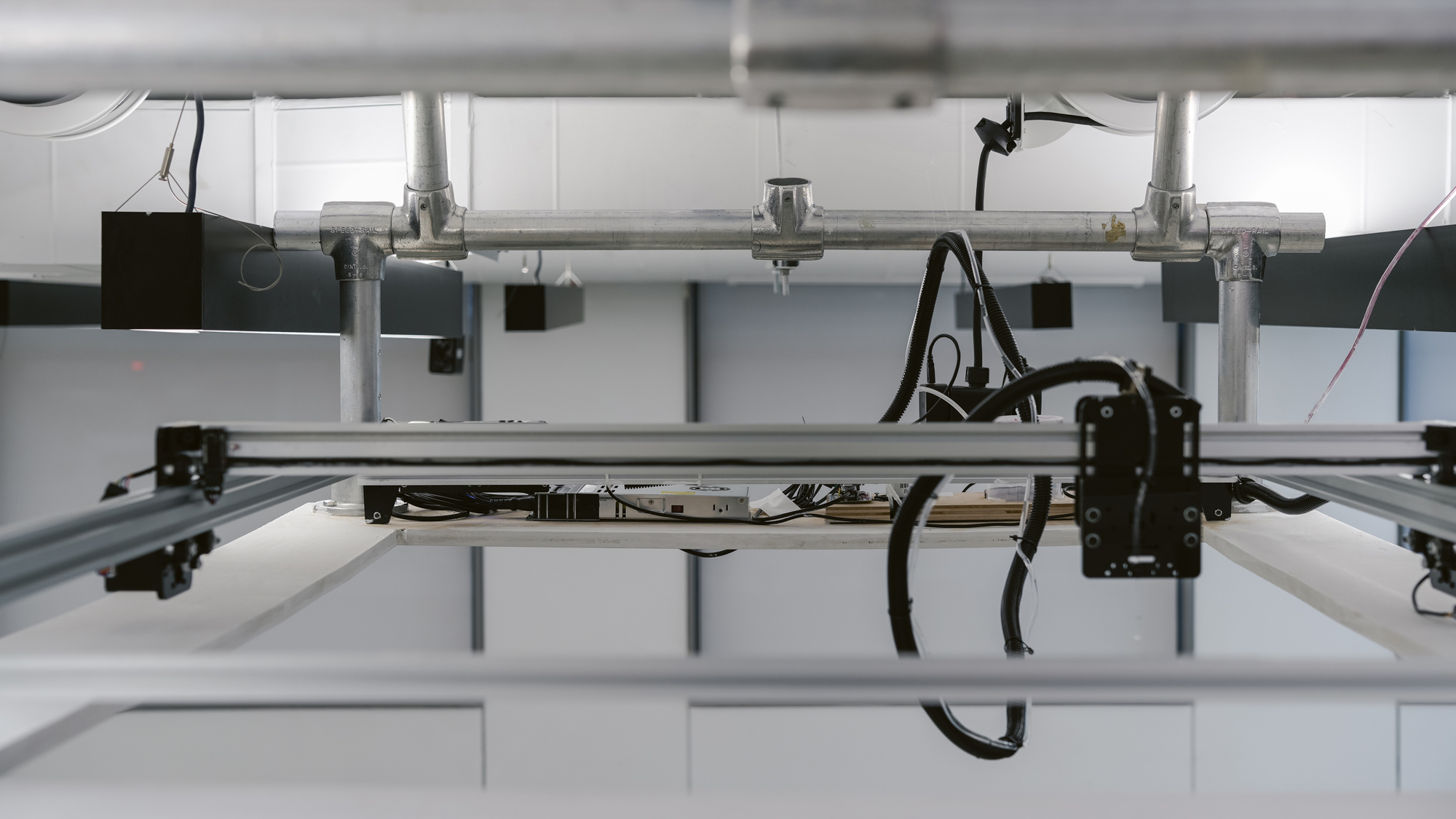 a CNC machine system hang from celling with metal frames