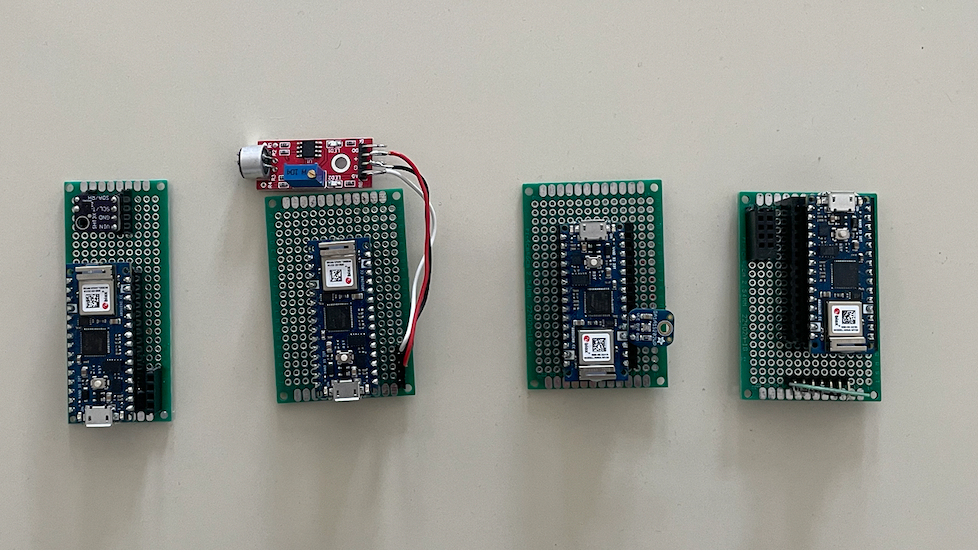 Four small arcylic houses with environmental sensors inside