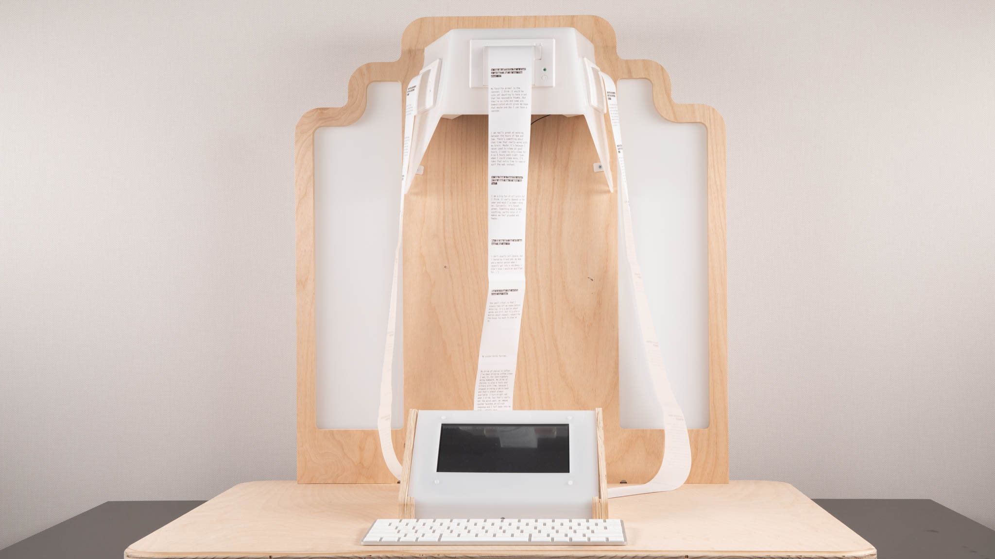 Altar, made of plywood, with a screen, keyboard, and thermal printers.