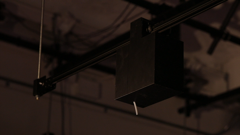 An animated gif of a close-up shot of the ink carriage making its way across the linear actuator.