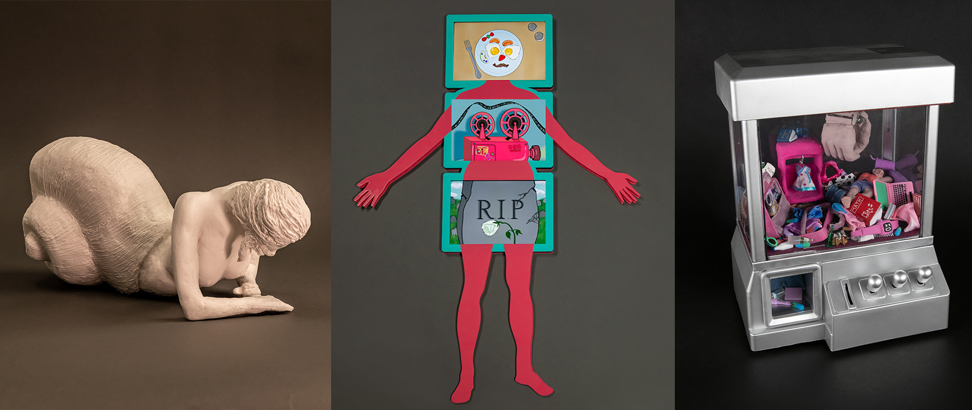 The three sculptures. Snail woman, acrylic body with ipads embedded into it, claw machine with doll clutter inside
