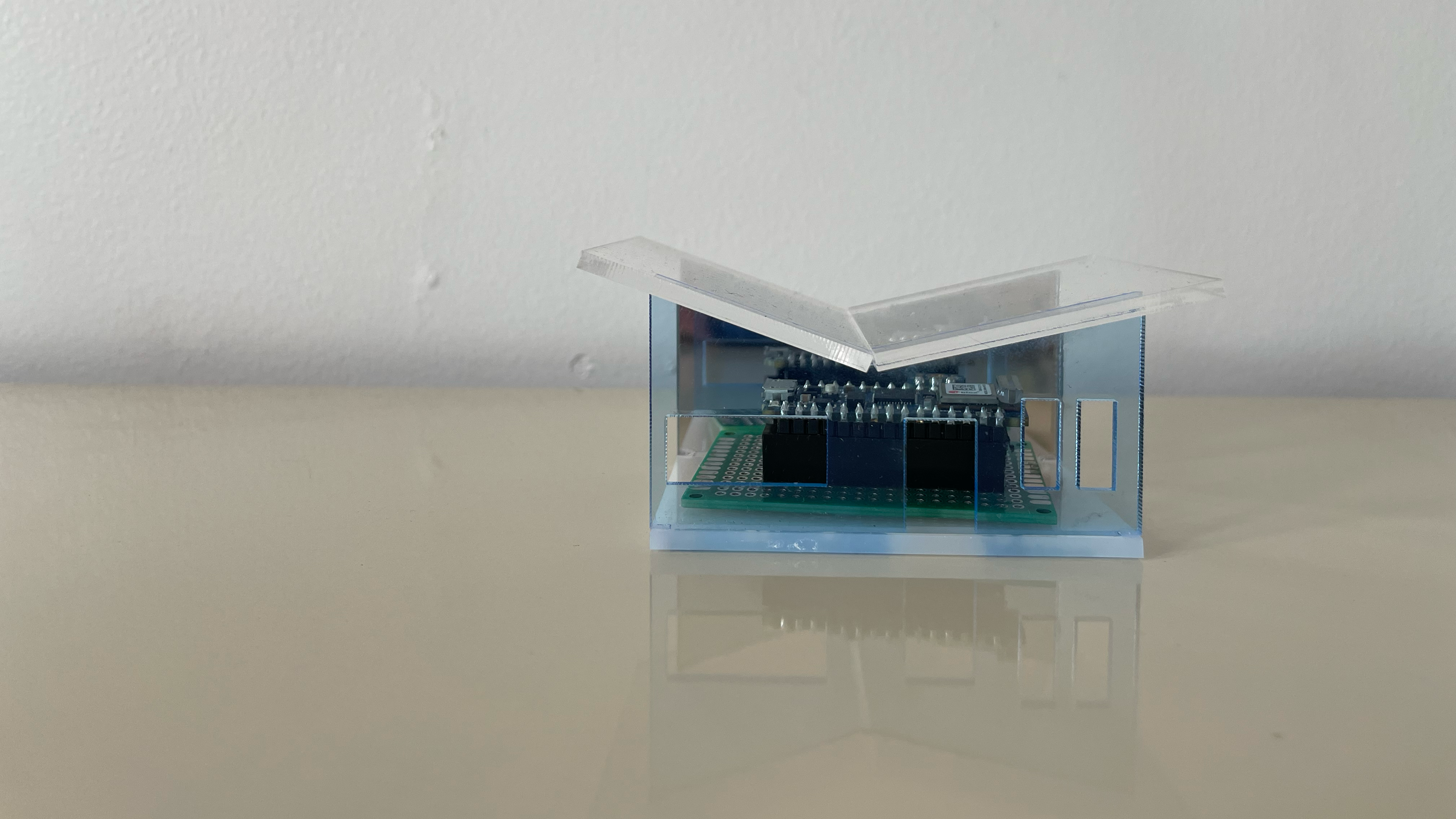 small acrylic house with light sensor