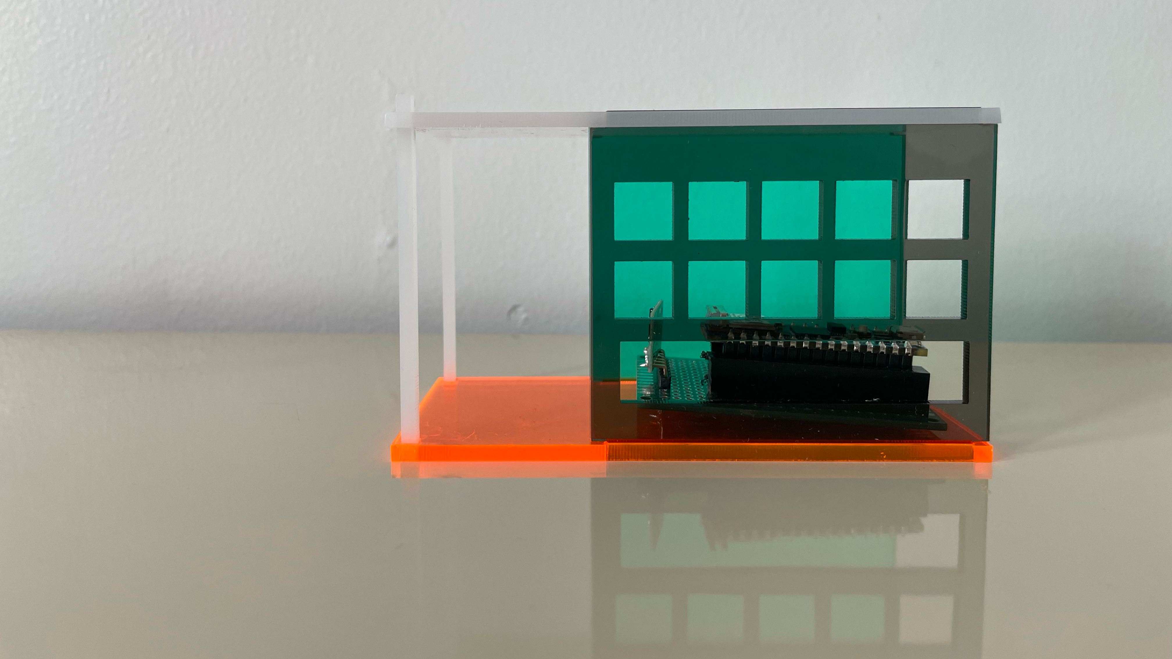 small acrylic house with distance sensor